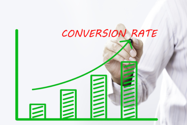 "CONVERSION RATE" text with hand of young businessman point on virtual graph green line and bar showing on increasing with background -business, finance, salary, crisis, and development concept
