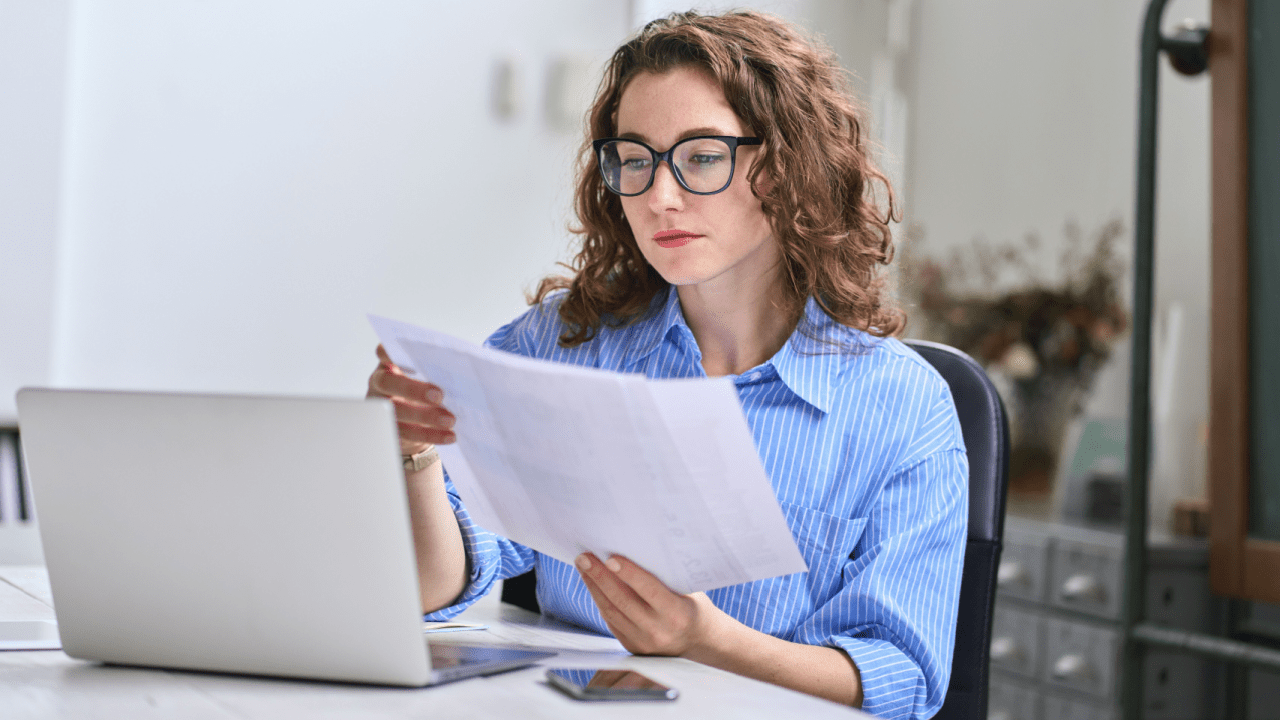 A lawyer reviewing lead generation reports from multiple legal lead providers on a laptop.