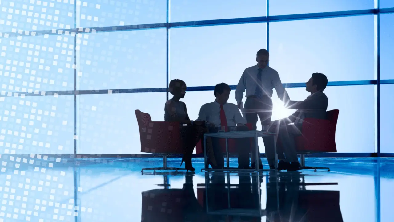 Executive legal team meeting in high-rise office discussing what are some effective law firm SEO strategies
