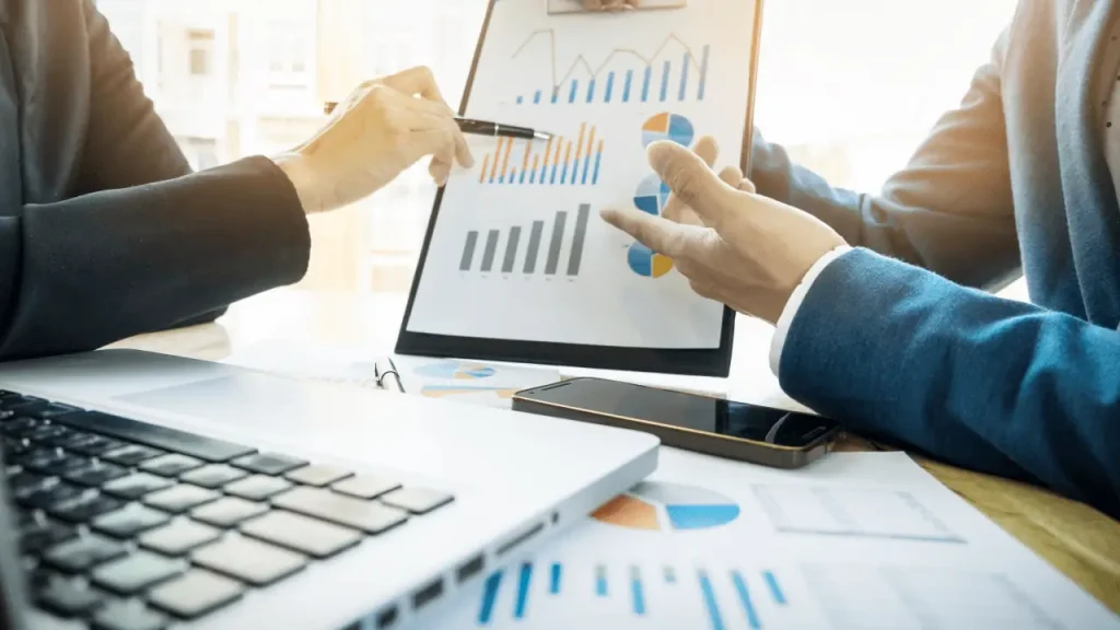 Digital promotion ideas for law practices shown through attorneys reviewing marketing analytics charts and data