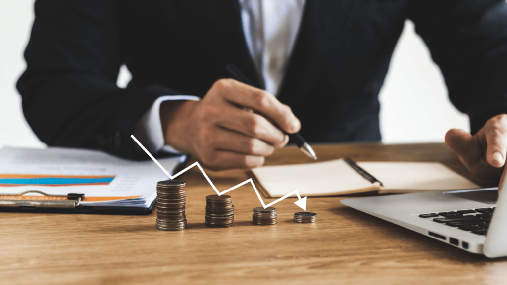 Bankruptcy lead cost analysis with declining coin stacks and downward chart arrow