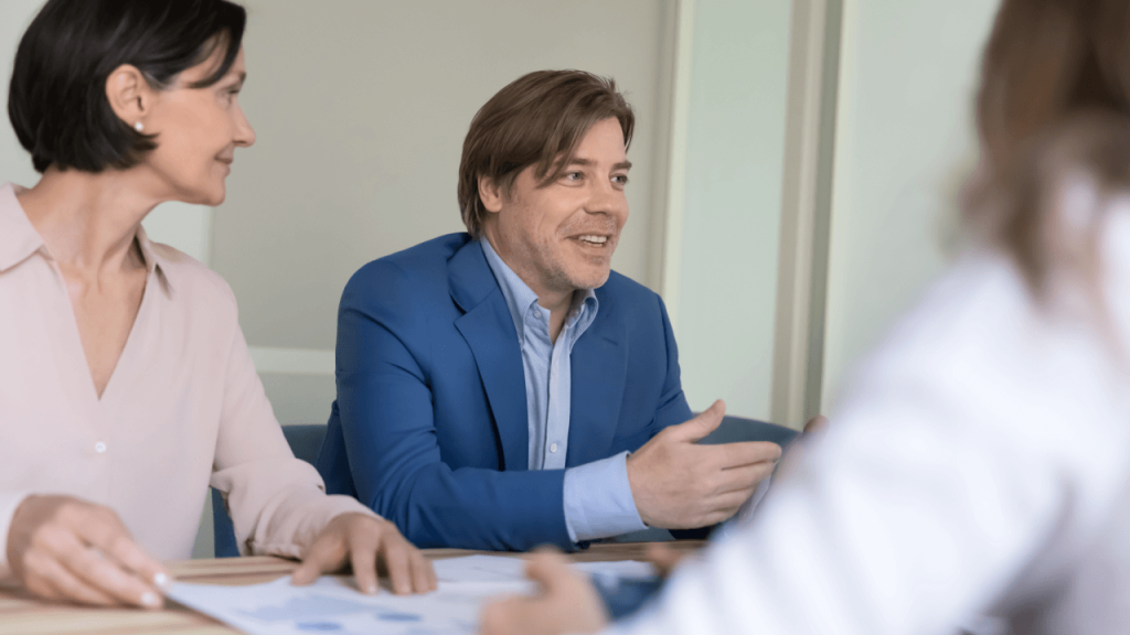 Attorneys discussing shared legal leads strategy during a law firm meeting