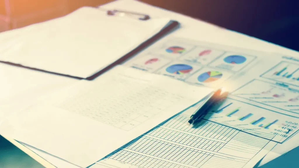 Attorney reviewing charts and data reports for measuring results from legal promotion strategies