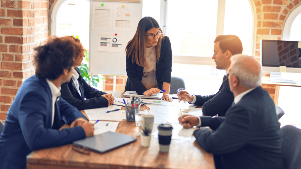 law firm advertising agency team reviewing strategy documents in office meeting